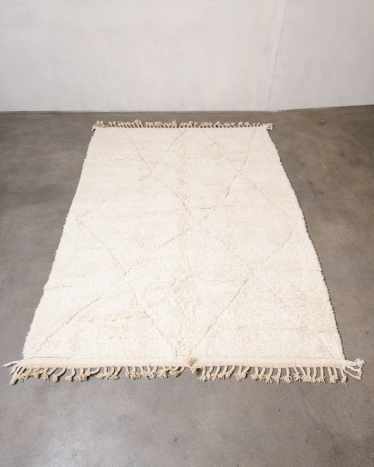 Modern, designer, handcrafted Berber rug from Morocco. Beniourain carpet with minimalist design, natural wool pile and a fluffy texture.